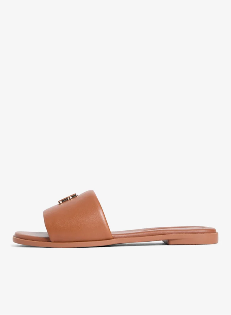 تومي هيلفيغر Leather Monogram Strap Mules
